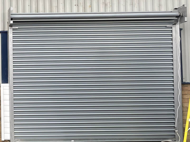 https://24shutterrepair.co.uk/wp-content/uploads/2021/11/Roller-shutter-doors.jpg